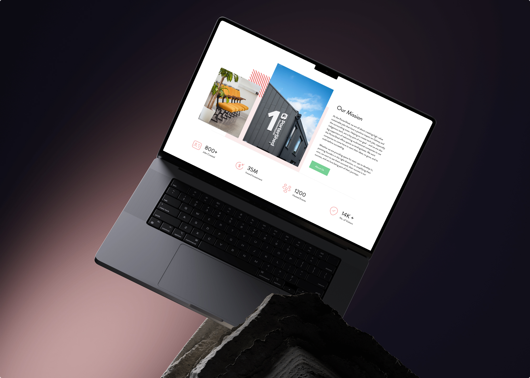 A laptop displaying a modern Simpl by Rob&Paul website with images, text, and icons about a company’s mission and statistics, placed at an angle against a dark gradient background with a concrete slab in the foreground.