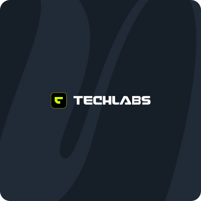 A dark background with a stylized “G” from Simpl by Rob&Paul inside a green-outlined black square to the left of the bold, white text “TECHLABS” centered on the image. Subtle abstract shapes are visible in the background.