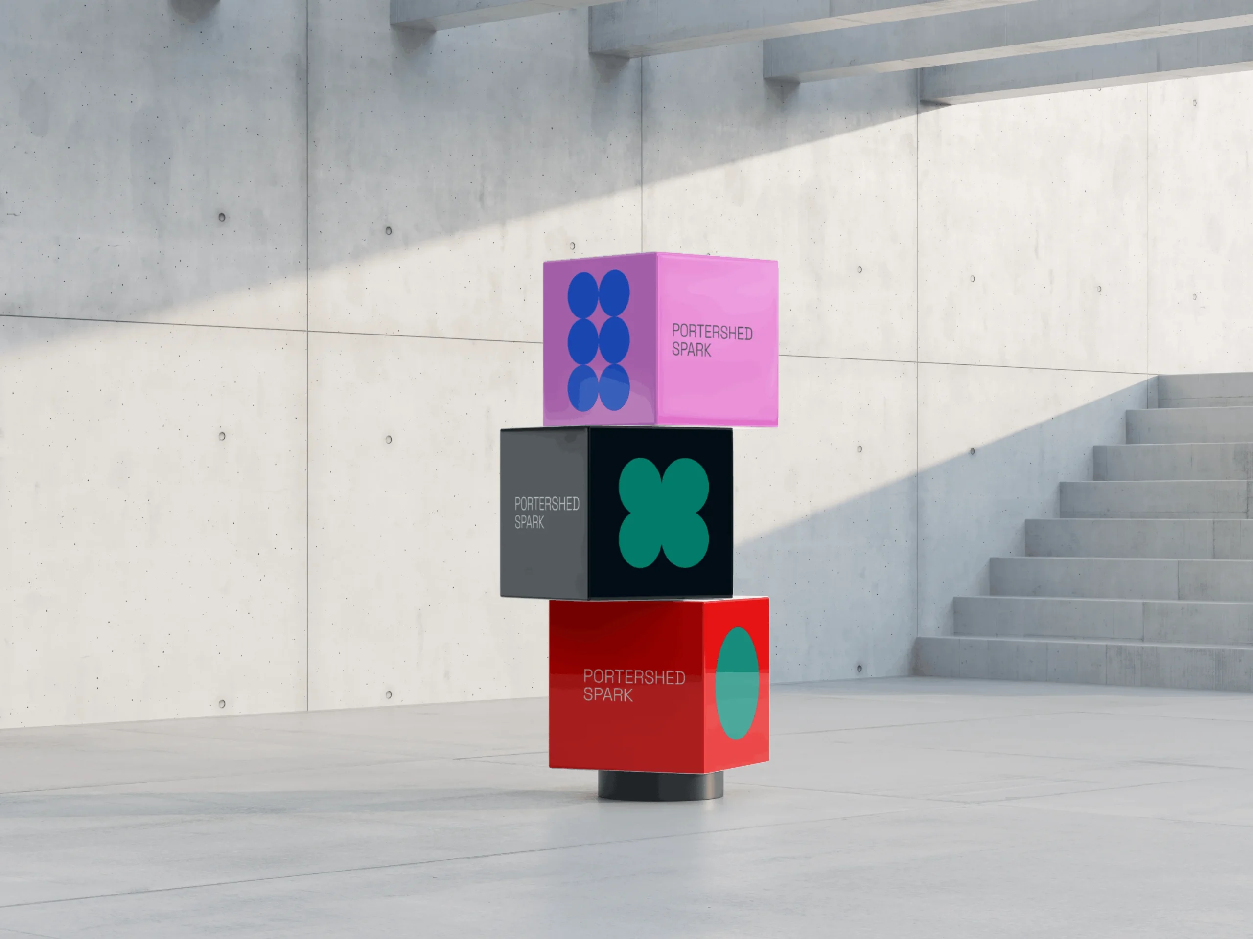 Three colorful cubes stacked in a modern concrete space, each labeled Portershed Spark with abstract geometric symbols inspired by Simpl by Rob&Paul; light enters from the top left, casting shadows on the floor and wall.