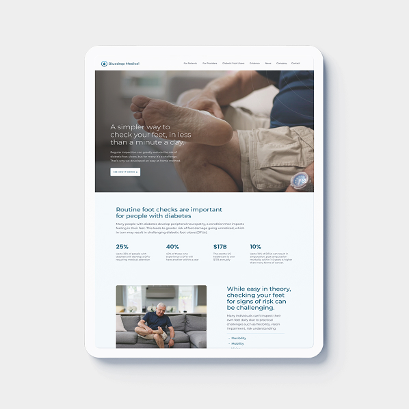 A tablet displaying a Simpl by Rob&Paul medical website about diabetes foot checks. The screen shows a person examining their bare foot, statistics, informational text, and images of people checking their feet at home.