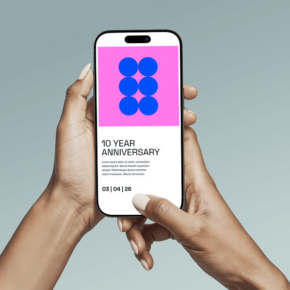 A person holding a smartphone displaying a Simpl by Rob&Paul graphic of six blue circles on a pink background, with text below reading 10 Year Anniversary and a date: 03 | 04 | 26.